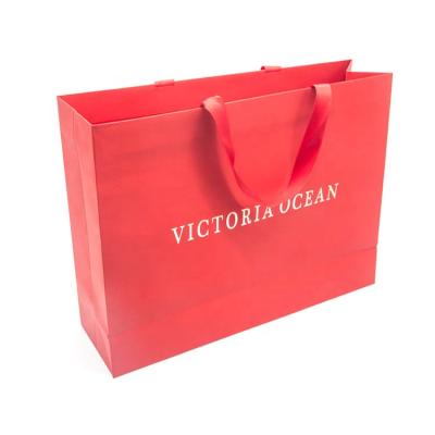 China Recyclable Luxury Red Paper Shopping Bags Custom Logo Printed Paper Shopping Bags for sale