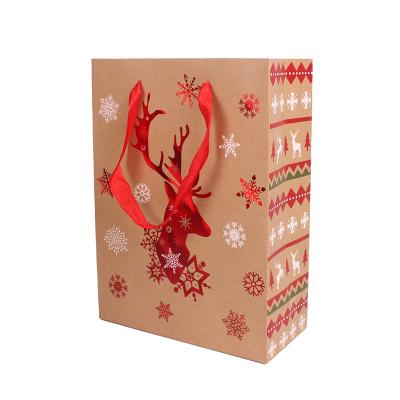 China New Recyclable Merry Christmas Gift Bag Cartoon Kraft Paper Bag Gift Packaging Bag for sale