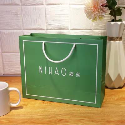 China Craft Hand Length Handle Boutique Paper Shopping Bag Recyclable Custom Luxury Paper Bags With Your Own Logo for sale