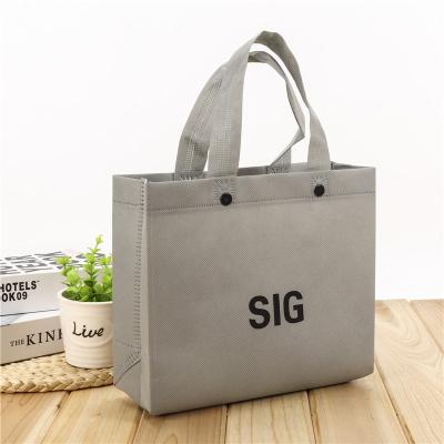 China Promotional cheap 100gsm gray color ultrasonic handled non woven bag with snap button for sale