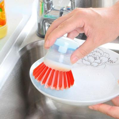 China Kitchen Cleaning Brush with ABS Handle Soap Dispensing Plastic Dishwashing Brush for sale