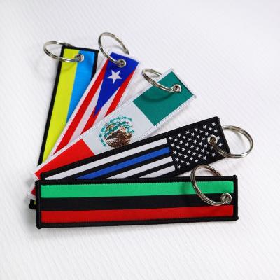 China Eco-friendly Material Customize Logo Embroidered Key Chain Car Locking Spray Tag Key Indicator for sale