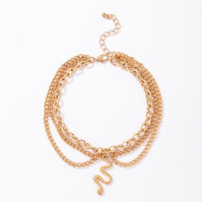 China Other Fashion Personalized Foot Anklet Chain Gold Buckle Chain Tassel 3 Layer Snakelike Dangling Anklet Wholesale Women Anklet Chain for sale