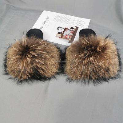 China CUSHIONING 2021 new luxury oversized raccoon fur women color shoes fur slippers for sale