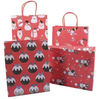 China Recyclable Red Color Snowman Brown Kraft Paper Christmas Gift Bags With Twisted Handle for sale