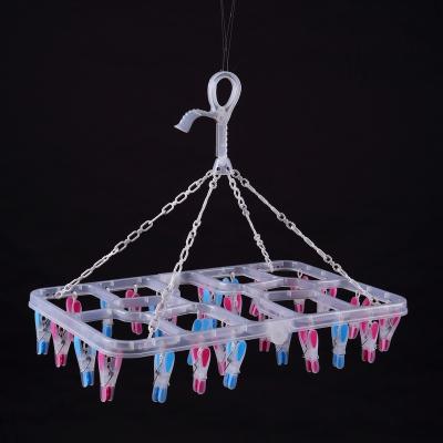 China New design folding plastic hanger with pegs of folding plastic hanger for sock for sale