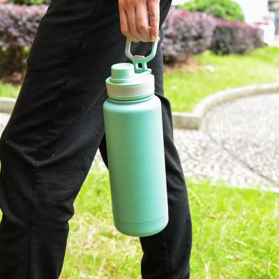 China Durable Screw Spout Lid With Bracket Wide Mouth Vacuum Insulated Small Big 32oz 64oz Ember Cup Water Bottle for sale