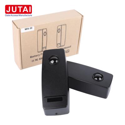 China Sistema de sensor de puerta corredera JUTAI Batería inalámbrica infrarroja Sensor de haz de fotocélula en venta