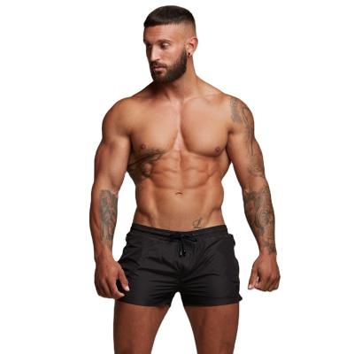 China New Anti-wrinkle muscle fitness brothers summer sports pants sweat absorbent fitness running slim fit shorts men's shorts for sale