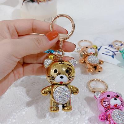 China 2022 Fashion Gold Diamond Metal Chinese Zodiac Tiger Key Chain Gantungan Kunci Tiger New Year Keychain Pink for sale