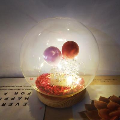 China Europe Round Glass Jar Current Wooden Bottom Glass Led Gypsophila Light Decoration Balloon Bottle Dome Glass Bottle for sale