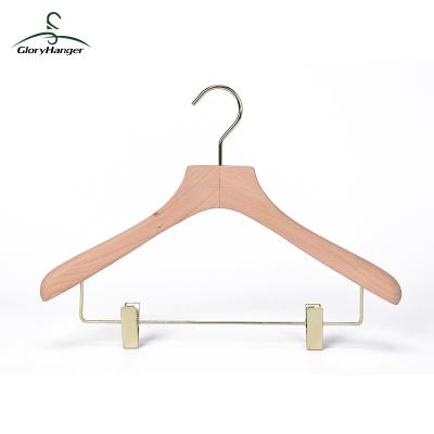 China Luxury wide shoulder anti-slip wooden coat hanger with gold metal clips and gold hook for sale