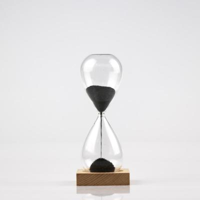 China Decorative Gift Magnet Wood Base Magnetic Sand Hourglass for Home Decor and Gifts for sale