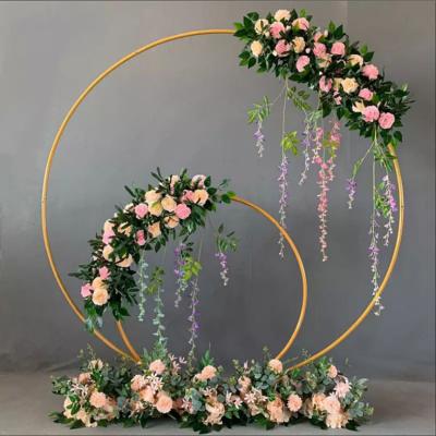 China Moden Ceremony Decoration Geometric Round Frame Backdrop Floral Gold Metal Wedding Arch Stand for sale