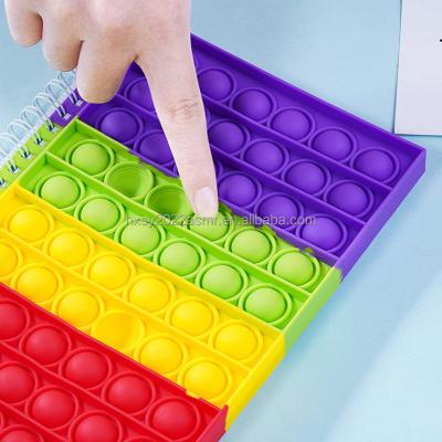 China 2022 silicone gifts bubbling push noise kids stir toys pops toy relaxation silicone rainbow pops notebook for sale