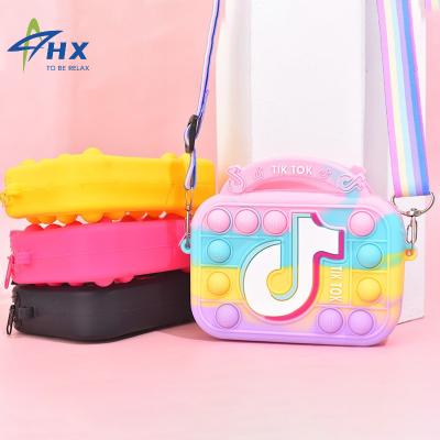 China Funny Educational Toy Pop Design Top Fashion Coin Purses Toys Jumping Purse Toys Money Bag Silicone Rainbow Tik Tok Pops Wiggle Purse for sale