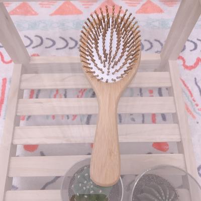 China Free Sample Nondisposable Hair Care Good For Detangling And Massaging Bamboo Hairbrush for sale