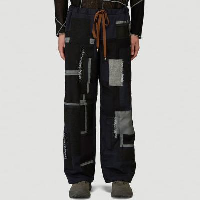 China 2022 Hot Sale Anti-wrinkle Recycled Materials Knitting Men's Drawstring Elastic Waist Oversized Track Pants With Splicing Design for sale