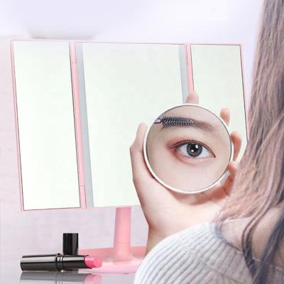 China Lighted Cosmetic Make Up Led Makeup Mirror Lights USB Charging 22 Light Foldable Magnifying Makeup Mirrors for sale