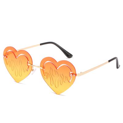 China 15 Years Experience Metal Frame Women Heart Fashion Rimless Sunglasses for sale