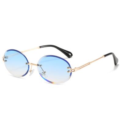 China 15 Years Experience New Metal Rimless Oval Retro Fashion Women Sunglasses for sale