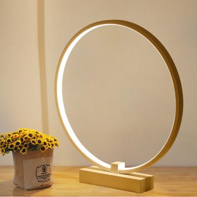 China Creative Mid Century Art Desk Light Round Iron Modern Bedroom LED Table Lamp for sale