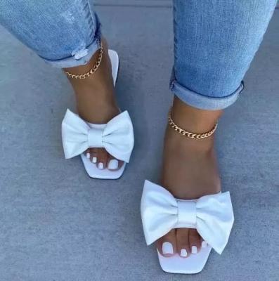 China Anti-Slippery Drop Shipping Fashionable Colorful Bow Flat Slippers For Women Beach Slippers Summer Slippers for sale