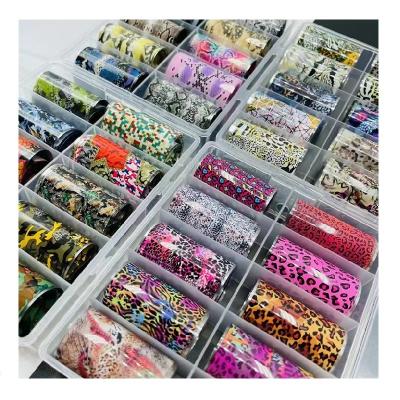 China Nail Art Decoration 10 Rolls / Stickers Wholesale Luxury Nail Box Brand Nail Foils With Famous Logo Popular Laser Luxury Nail Foils for sale