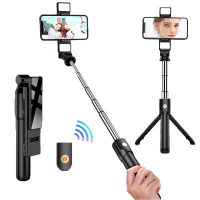 China Portable Flexible 3 in 1 360 Rotation Aluminum Detachable Radio Selfie Stick Remote Extendable Tripod with Fill Light for sale