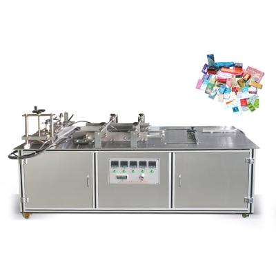 China semi-automatic food pe film soap card game perfume box cellophane wrapping machine for sale