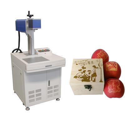 China Desktop Laser Marking Printer CO2 Laser Marking Machine Used For Marking Apples And Packaging Gift Boxes for sale