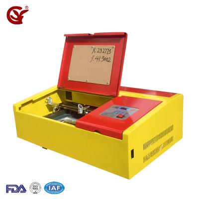 China Laser Engraving Rubber Stamp Laser Engraving Marking Machine Cheap Laser Engraver CO2 Laser Engraving Machine for sale