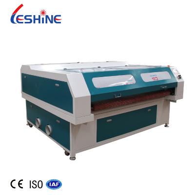 China Laser CUT Textile Cloth Clothes Fabric Cutting Automatic Feed Level Device CO2 Laser Cutting Machine With CCD for sale