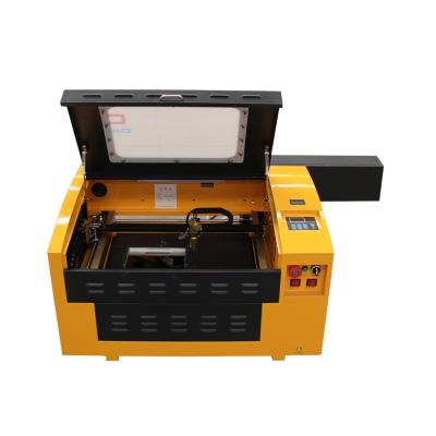 China Laser Engraving Mini 4030 Laser Engraving Cutting Machine for Acrylic Wood Rubber Leather Nonmetal with Rotary Desktop CO2 Laser Engraver m3050 for sale