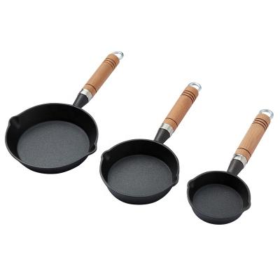 China General use for Thai Round Gas Stron cookwre Kitchen Egg Frying Pan Cast Iron and Induction Cooker Cooking Mini Skillet with Wooden Handle for sale