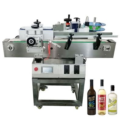 China Food Right to Left Customize Automatic Round Bottle Label Printing Pet Water Sticker Labeling Machine for sale