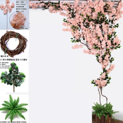 China Widely Used Artificial Rattan Wedding Cherry Blossom Tree Branch Vine Home Decor for sale