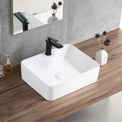 China New Design Modern Table Top Art Basin White Handmade Ceramic Wash Basin for sale