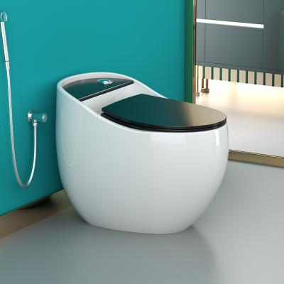 China Colorful Round Egg Shape One Piece Ceramic Floor Standing Double-Flow Commode Toilet for sale