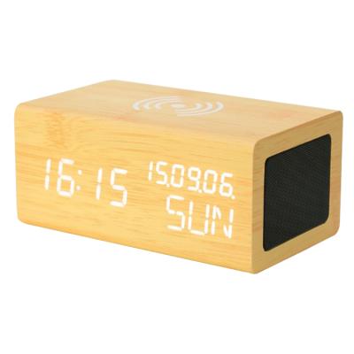 China Wooden BT Wireless Speaker Calendars Qi Phone Charger Wooden Alarm Clock with Calendar Temperature Display for sale