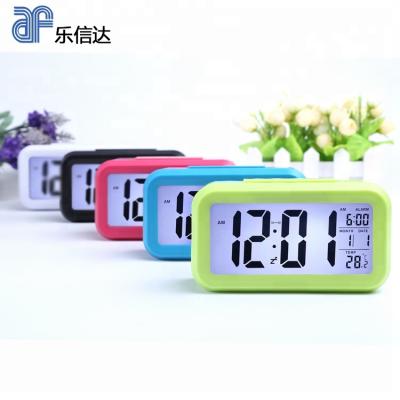 China Classroom Common Decorative Blacklight Clock EMAF Temperature LCD Digital Student Alarm Clock With Backlight for sale