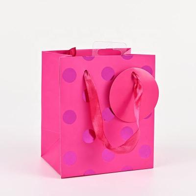 China Customization Recyclable Logo Lovely Gift Paper Bags With Label Round Fashion Foil Rose Gold Cosmetic Bags Dot Design Jewelry Bags Special for sale