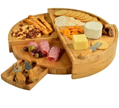 China Patented Combohome Sustainable Luxury Round Wooden Natural Bamboo Cheese Charcuterie Cutting Board With Knife Set for sale