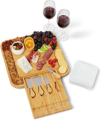 China Large Sustainable Bamboo Cheese Cutting Dishes Panel Set and Knife Set with Hidden Slide Out Drawers Charcuterie Tray Wood Panel for sale