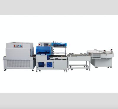 China Furimach automatical flat shrink packing machine horizontal shrink package machine tape shrinking packing machine for sale