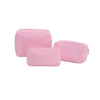 China Waterproof Nylon Lightweight Luminous Cosmetic Bag Travel Organizer Letter Colors Letter Cosmetic Makeup Bag for sale