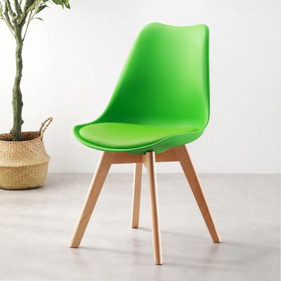 China Modern Popular Wooden Legs White Cushion Plastic Dining Chair Tulip Dining Chair for sale