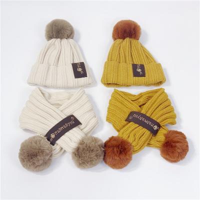 China Newest Designer Winter Kids Long Knit Beanies Fur Pom Pom Hat Scarf Two Piece Set for sale