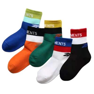 China Autumn And Winter Style Boys Sports Socks Alphabet Children Sports Splicing Socks for sale