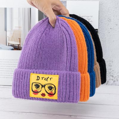 China New Arrival JOINT Acrylic Knit Custom Winter Beanie Hats Winter Caps With Eyeglass Applique for sale